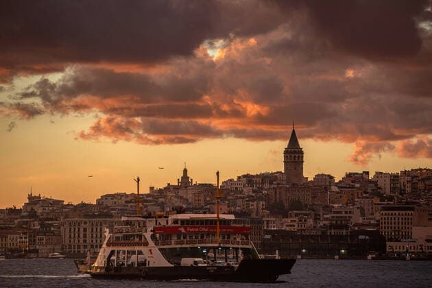 September 22, 2022, Istanbul, Turkey: At the sunset in Istanbul, the ferry on the Bosphorus line and the Galata Tower in the background, and the clouds in the sky created a beautiful view. Istanbul Turkey - ZUMAs197 20220922_zaa_s197_263 Copyright: xOnurxDogmanx