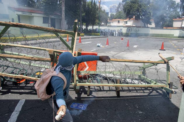 September 23, 2022, Mexico City, Mexico: Ayotzinapa students and members of civil associations, take part during confrontations against the police causing disturbances at the entrance of Military Zone 1 as part of the National Day of Struggle, demanding justice for the forced disappearance of the 43 students of the Rural Normal School of Ayotzinapa, 8 years after the massacre of the Students of Ayotzinapa. on September 23, 2022, Mexico City, Mexico. Mexico City Mexico - ZUMAe321 20220923_zia_e321_027 Copyright: xAlexxDaltonxEyepixxGroupx
