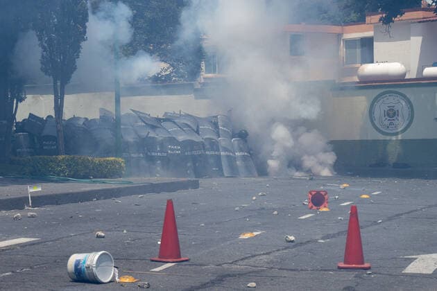 September 23, 2022, Mexico City, Mexico: Ayotzinapa students and members of civil associations, take part during confrontations against the police causing disturbances at the entrance of Military Zone 1 as part of the National Day of Struggle, demanding justice for the forced disappearance of the 43 students of the Rural Normal School of Ayotzinapa, 8 years after the massacre of the Students of Ayotzinapa. on September 23, 2022, Mexico City, Mexico. Mexico City Mexico - ZUMAe321 20220923_zia_e321_028 Copyright: xAlexxDaltonxEyepixxGroupx