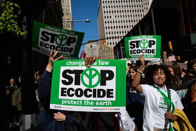 September 23, 2022, New York City, United States: Protesters hold placards reading, Stop ecocide during the climate strike. Hundreds of youth climate protesters marched from Foley Square to Battery Park with Fridays for the Future International Climate Strike. New York City United States - ZUMAs197 20220923_zaa_s197_181 Copyright: xKarlaxCotx