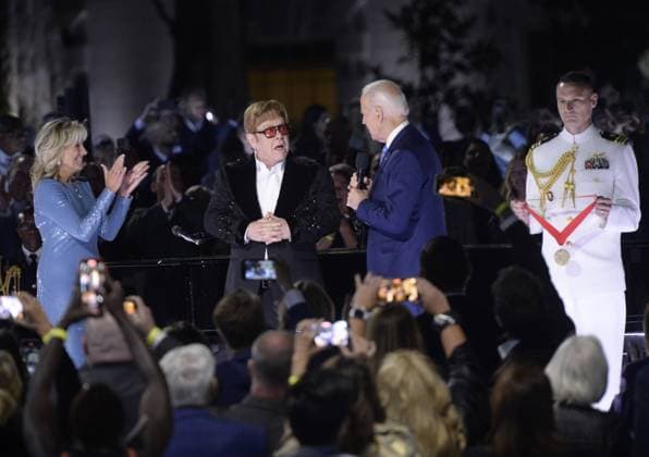 President Joe Biden presents Elton John with the National Humanities Medal after he preformed a show called A Night When Hope and History Rhyme as part of his farewell tour on the South Lawn of the White House in Washington, DC on Friday, September 23, 2022.  WAP20220923226 BONNIExCASH