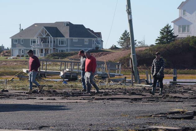 September 25, 2022, Covehead, PEI, Canada: Lobster fishermen check the damage to the wharf in Covehead, P.E.I. on Sunday, September 25, 2022. After hammering Atlantic Canada, post-tropical storm Fiona has moved inland in southeastern Quebec, with Environment Canada saying the storm will continue to weaken as it tracks across southeastern Labrador and over the Labrador Sea. Covehead Canada  - ZUMAc35_ 20220925_zaf_c35_099 Copyright: xBrianxMcinnisx