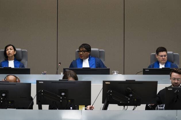 2022-09-26 09:34:29 Presiding judge Miatta Maria Samba, center, opens the trial of Mahamat Said Abdel Kani at the International Criminal Court in The Hague, Netherlands, Monday, Sept. 26, 2022. The trial of an alleged commander in a mainly Muslim rebel group from Central African Republic opened and charged Said with crimes against humanity and war crimes. (AP Photo Peter Dejong, Pool) netherlands out - belgium out