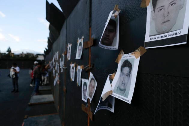 September 26, 2022, Mexico, Mexico: Pictures of the 43 missing students were placed on the fences of the National Palace during a demonstration to commemorate the 8th anniversary of the disappearance of the 43 Ayotzinapa students. On the night of September 26, 2014, 43 students from the Raoel Isidro Burgos Rural Normal School located in Iguala, Guerrero, were victims of forced disappearance by members of public security from the state of Guerrero and federal military security..The students had allegedly tried to hijack trucks to use for their protests. Mexico Mexico - ZUMAs197 20220926_zaa_s197_326 Copyright: xGuillermoxDiazx