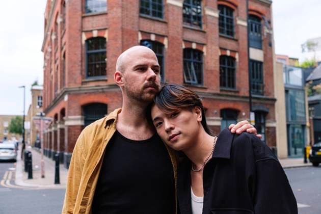 Man embracing boyfriend standing in city model released, Symbolfoto, ASGF02884