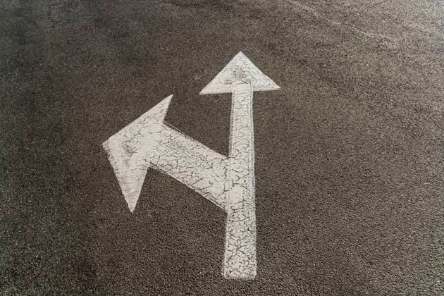 Road marking with two arrows drawn on asphalt, OSF00804