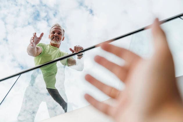 Smiling man reaching for hand of friend model released, Symbolfoto, VPIF07050