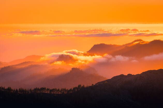 Spectacular scenery of vivid pink and orange sundown cloudy sky over rough mountains in evening on Gran Canaria, Model released JavierMartinez_ID783_29070_040 Copyright: xJavierxMartinezx MR