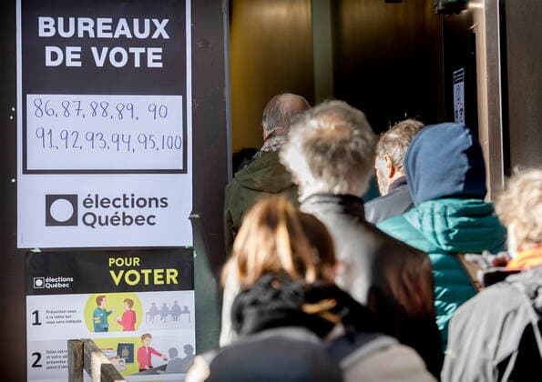 October 3, 2022, Montreal, PQ, Canada: People wait in line to vote on Quebec election day in Montreal, Monday, October 3, 2022. Montreal Canada  - ZUMAc35_ 20221003_zaf_c35_001 Copyright: xGrahamxHughesx