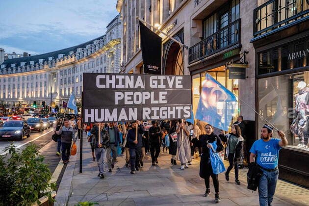 October 1, 2022, London, United Kingdom: Protesters seen marching to the Chinese Embassy with installation arts and flags at Regent Street during the demonstration. Hongkongers, Tibetans and Uyghurs communities held a joint rally and March in London to protest against the celebration of the National Day of the People s Republic of China. The rally started on Piccadilly Circus and called the public to defend human rights in China. London United Kingdom - ZUMAs197 20221001_zaa_s197_345 Copyright: xHestherxNgx