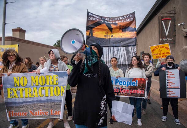 October 3, 2022, USA: Isabela Maestas, with Pueblo Action Alliance, leads around 50 protesters along San Francisco Street in Santa Fe, Monday, October 3, 2022. The protest is organized by YUCCA (Youth United for Climate Crisis Acrtion) is protesting outside the Eldorado Hotel where the New Mexico Oil and Gas Association is meeting. The group is protesting against oil and gas exstraction in New Mexico. USA - ZUMAab1_ 20221003_zaf_ab1_008 Copyright: xEddiexMoorex