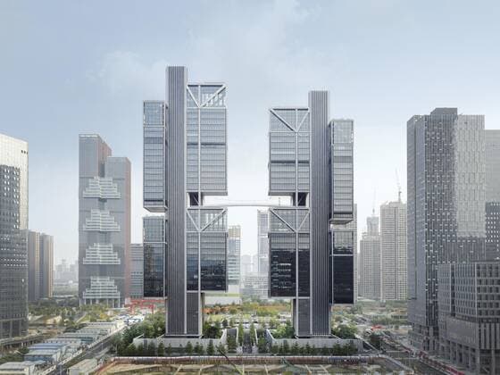 **VIDEO AVAILABLE: CONTACT INFO@COVERMG.COM TO RECEIVE** British architecture studio Foster + Partners has completed two skyscrapers - connected by an open-air suspension bridge, 105 meters above the ground - for Chinese drone manufacturer DJI in Shenzhen called DJI Sky City. DJI Sky City in Shenzen is comprised of the two 200-metre-high skyscrapers that now house the the robotics company and drone specialists DJI. The bridge is attached to each of the towers by vertically slatted cores, which both support a series of steel truss-encased, glass volumes that were stacked and cantilevered on top of one another. Its ground floor houses public facilities, including a community healthcare centre, and lobbies that each contain an indoor zen g Copyright: xx 52040756 EDITORIAL USE ONLY. NOT FOR USE BY NEWSPAPERS BASED IN THE UK.