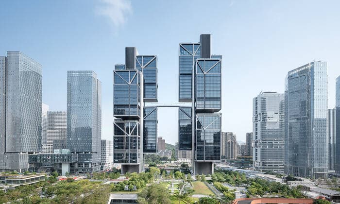 **VIDEO AVAILABLE: CONTACT INFO@COVERMG.COM TO RECEIVE** British architecture studio Foster + Partners has completed two skyscrapers - connected by an open-air suspension bridge, 105 meters above the ground - for Chinese drone manufacturer DJI in Shenzhen called DJI Sky City. DJI Sky City in Shenzen is comprised of the two 200-metre-high skyscrapers that now house the the robotics company and drone specialists DJI. The bridge is attached to each of the towers by vertically slatted cores, which both support a series of steel truss-encased, glass volumes that were stacked and cantilevered on top of one another. Its ground floor houses public facilities, including a community healthcare centre, and lobbies that each contain an indoor zen g Copyright: xx 52040757 EDITORIAL USE ONLY. NOT FOR USE BY NEWSPAPERS BASED IN THE UK.