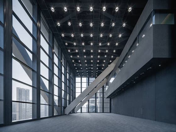 **VIDEO AVAILABLE: CONTACT INFO@COVERMG.COM TO RECEIVE** British architecture studio Foster + Partners has completed two skyscrapers - connected by an open-air suspension bridge, 105 meters above the ground - for Chinese drone manufacturer DJI in Shenzhen called DJI Sky City. DJI Sky City in Shenzen is comprised of the two 200-metre-high skyscrapers that now house the the robotics company and drone specialists DJI. The bridge is attached to each of the towers by vertically slatted cores, which both support a series of steel truss-encased, glass volumes that were stacked and cantilevered on top of one another. Its ground floor houses public facilities, including a community healthcare centre, and lobbies that each contain an indoor zen g Copyright: xx 52040746 EDITORIAL USE ONLY. NOT FOR USE BY NEWSPAPERS BASED IN THE UK.