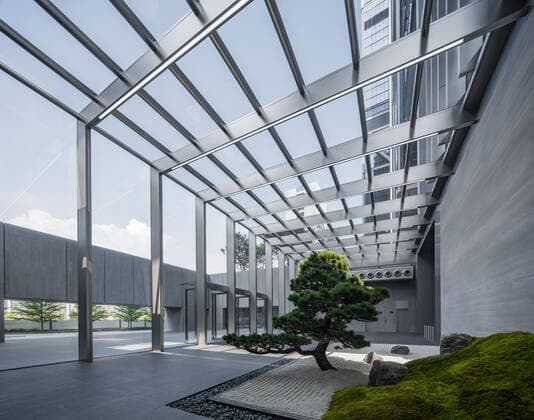 **VIDEO AVAILABLE: CONTACT INFO@COVERMG.COM TO RECEIVE** British architecture studio Foster + Partners has completed two skyscrapers - connected by an open-air suspension bridge, 105 meters above the ground - for Chinese drone manufacturer DJI in Shenzhen called DJI Sky City. DJI Sky City in Shenzen is comprised of the two 200-metre-high skyscrapers that now house the the robotics company and drone specialists DJI. The bridge is attached to each of the towers by vertically slatted cores, which both support a series of steel truss-encased, glass volumes that were stacked and cantilevered on top of one another. Its ground floor houses public facilities, including a community healthcare centre, and lobbies that each contain an indoor zen g Copyright: xx 52040743 EDITORIAL USE ONLY. NOT FOR USE BY NEWSPAPERS BASED IN THE UK.