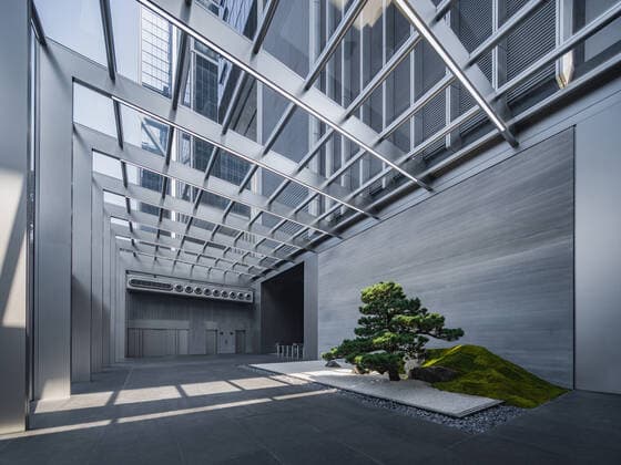 **VIDEO AVAILABLE: CONTACT INFO@COVERMG.COM TO RECEIVE** British architecture studio Foster + Partners has completed two skyscrapers - connected by an open-air suspension bridge, 105 meters above the ground - for Chinese drone manufacturer DJI in Shenzhen called DJI Sky City. DJI Sky City in Shenzen is comprised of the two 200-metre-high skyscrapers that now house the the robotics company and drone specialists DJI. The bridge is attached to each of the towers by vertically slatted cores, which both support a series of steel truss-encased, glass volumes that were stacked and cantilevered on top of one another. Its ground floor houses public facilities, including a community healthcare centre, and lobbies that each contain an indoor zen g Copyright: xx 52040742 EDITORIAL USE ONLY. NOT FOR USE BY NEWSPAPERS BASED IN THE UK.