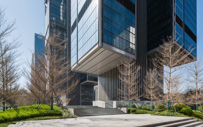 **VIDEO AVAILABLE: CONTACT INFO@COVERMG.COM TO RECEIVE** British architecture studio Foster + Partners has completed two skyscrapers - connected by an open-air suspension bridge, 105 meters above the ground - for Chinese drone manufacturer DJI in Shenzhen called DJI Sky City. DJI Sky City in Shenzen is comprised of the two 200-metre-high skyscrapers that now house the the robotics company and drone specialists DJI. The bridge is attached to each of the towers by vertically slatted cores, which both support a series of steel truss-encased, glass volumes that were stacked and cantilevered on top of one another. Its ground floor houses public facilities, including a community healthcare centre, and lobbies that each contain an indoor zen g Copyright: xx 52040738 EDITORIAL USE ONLY. NOT FOR USE BY NEWSPAPERS BASED IN THE UK.