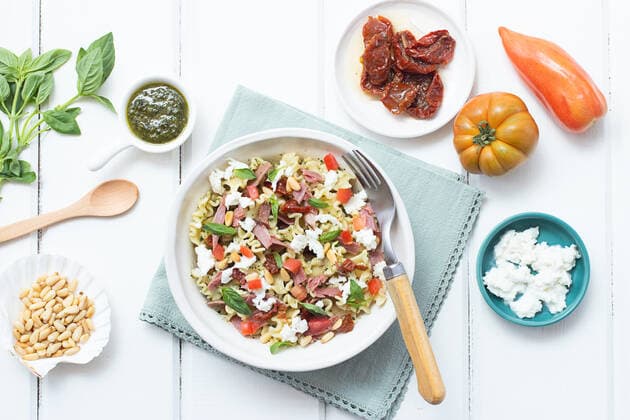 From above appetizing salad mixed with various fresh ingredients on wooden white table OlgaVila_ID988_37173_003 Copyright: xOlgaxVilax Model Released