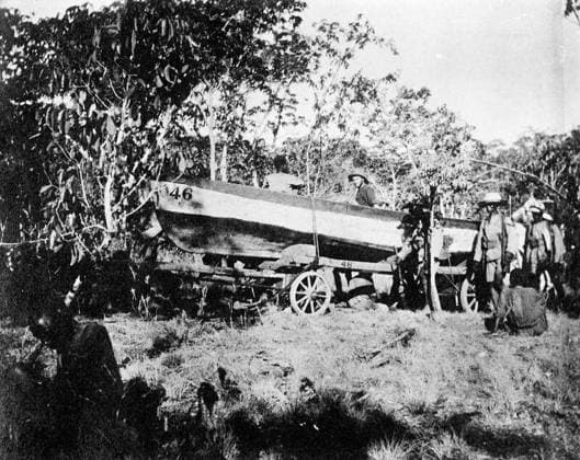 Ministry of Information First World War Official Collection German East African Campaign. Boat en route for Rufigi river, from Mikesse (approximately 150 miles through the bush), to be used as ferry boat; fitted with Ford Motor Engine. The current proved too strong for these engines and they were practically useless. Copyright: xpiemagsx minofinfopieww04102022-105 !ACHTUNG AUFNAHMEDATUM GESCHÄTZT!