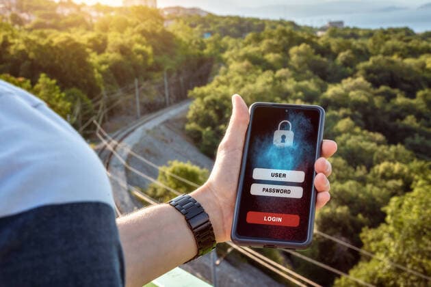 October 10, 2022: Man holds smartphone in his hand and has opened an application, app or website in which access data must be entered. User and password to log in. Technical security on cell phone concept PHOTOMONTAGE *** Mann hält Smartphone in seiner hand und hat eine Anwendung, App oder Website geöffnet in der Zugangsdaten für den Zugang eingegeben werden müssen. Nutzer und Passwort zum Login. Technische Sicherheit am Mobiltelefon Konzept FOTOMONTAGE