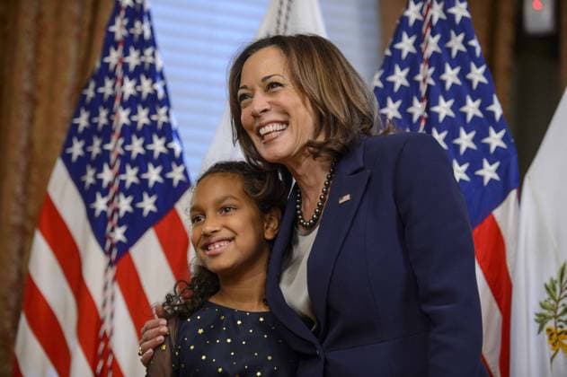 Vice President Kamala Harris (R) smiles with Maya LeBlanc after her father, Travis LeBlanc, was ceremonially sworn in as a member of the Privacy and Civil Liberties Oversight Board in the Dwight D. Eisenhower Executive Office Building in Washington, DC on Tuesday, October 11, 2022. 1 WAP20221011363 BONNIExCASH