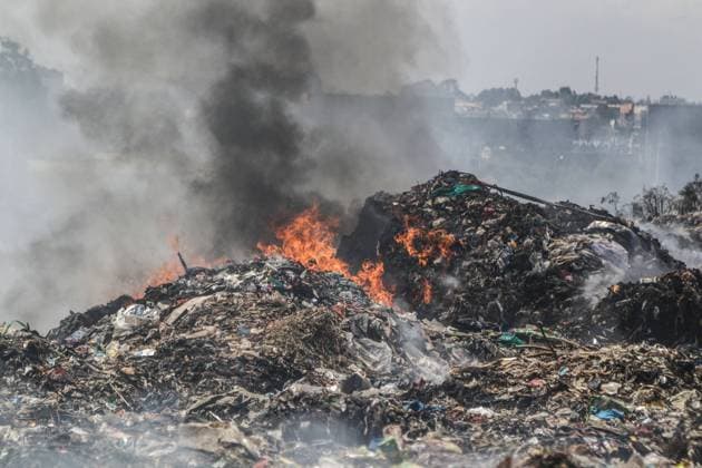 October 11, 2022, Nairobi, Kenya: Smoke rises from burning rubbish at Dandora Dumping Site. There are concerns that smoke from burning garbage emits toxic chemicals that pose environmental and public health problems. Scavengers and the community bordering landfills where waste is openly burnt are heavily affected. Nairobi Kenya - ZUMAs197 20221011_zab_s197_066 Copyright: xJamesxWakibiax