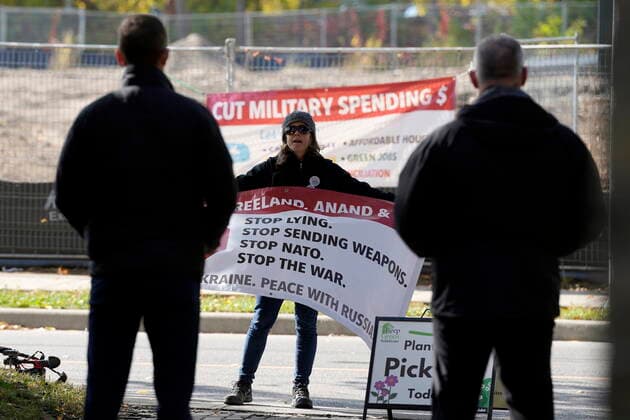 October 14, 2022, Kitchener, ON, CANADA: An anti-war protester demonstrates outside an event where Prime Minister Justin Trudeau was taking a tour of Reep Green Solutions in Kitchener, Ont., Friday, Oct. 14, 2022. Kitchener CANADA  - ZUMAc35_ 20221014_zaf_c35_054 Copyright: xFrankxGunnx