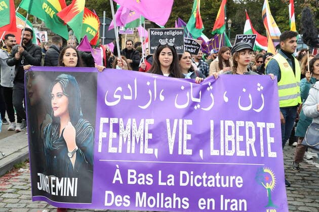 Illustration picture shows a protest to support the Iranian people, in Brussels, Saturday 15 October 2022. More than 200 people have been killed in protests in Iran after the death of 22-year-old Mahsa Amini. The protest movement in Iran started after Amini died in hospital. She had been arrested for not following the strict dress code in the Islamic republic. Despite hundreds of arrests, the protest movement is not weakening, often with the slogan Woman, Life, Freedom .  NICOLASxMAETERLINCK 47102064