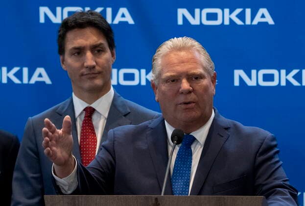 October 17, 2022, Ottawa, ON, Canada: Prime Minister Justin Trudeau looks on as Ontario Premier Doug Ford responds to a question following an announcement in Ottawa, Monday, Oct. 17, 2022. Ottawa Canada  - ZUMAc35_ 20221017_zaf_c35_013 Copyright: xAdrianxWyldx