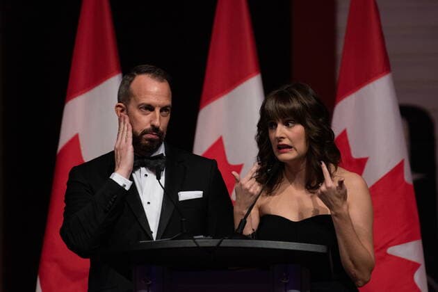 October 22, 2022, Gatineau, PQ, Canada: Mike Le Couteur, left, and Marie Vastel deliver remarks as MCs during the Parliamentary Press Gallery Dinner at the Museum of History in Gatineau, Que., on Saturday, Oct. 22, 2022. Gatineau Canada - ZUMAc35_ 20221022_zaf_c35_034 Copyright: xSpencerxColbyx