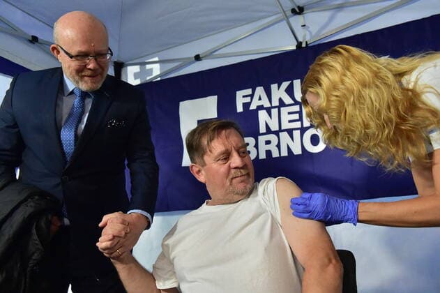 Czech Health Minister Vlastimil Valek (TOP 09), left, gives press conference on COVID-19 vaccination campaign We get vaccinated for life without fear in Brno University Hospital. Czech actor and comedian Petr Ctvrnicek receives COVID-19 vaccination in Brno University Hospital, Czech Republic, October 24, 2022. (CTKxPhoto VaclavxSalek) CTKPhotoP2022102402589 