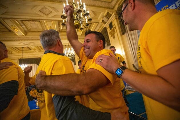 October 26, 2022, Winnipeg, MB, Canada: People from the group Firefighters for Public Safety celebrate prematurely after a media outlet declared a victory for Glen Murray, and then retracted the statement, at Murray™s election night headquarters at the Hotel Fort Garry in Winnipeg, on Wednesday, October 26, 2022. Winnipeg Canada  - ZUMAc35_ 20221026_zaf_c35_149 Copyright: xDanielxCrumpx