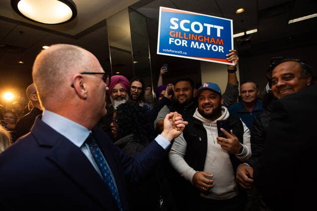 October 26, 2022, Winnipeg, MB, Canada: Scott Gillingham celebrates with supporters as he makes his way to the podium for his victory speech after being declared the next mayor of Winnipeg, on Wednesday, October 26, 2022. Winnipeg Canada  - ZUMAc35_ 20221026_zaf_c35_153 Copyright: xDanielxCrumpx