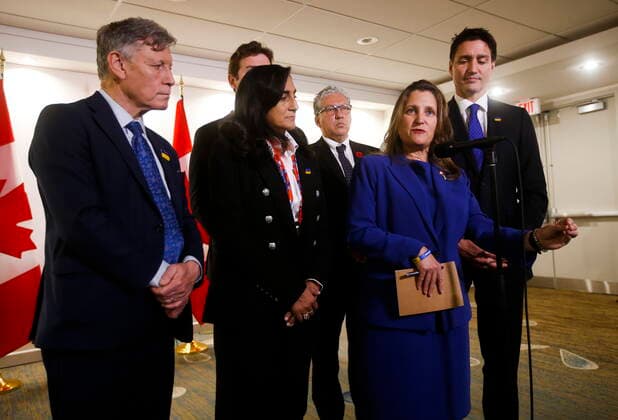 October 28, 2022, WINNIPEG, MB, CANADA: Minister of Finance and Deputy Prime Minister Chrystia Freeland and Prime Minister Justin Trudeau are photographed with other MPs after attending and speaking at the opening ceremony of the Triennial Congress of Ukrainian Canadians at the Delta hotel in Winnipeg, Friday, Oct. 28, 2022. WINNIPEG CANADA  - ZUMAc35_ 20221028_zaf_c35_072 Copyright: xJohnxWoodsx