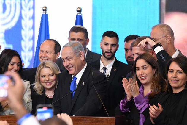 (221102) -- JERUSALEM, Nov. 2, 2022 -- This photo taken on Nov. 2, 2022 shows former Israeli Prime Minister and leader of the Likud party Benjamin Netanyahu (C) at the party headquarters in Jerusalem. Exit polls from Israel s parliamentary elections suggested Tuesday that former Prime Minister Benjamin Netanyahu s bloc has a good chance of making a comeback after the country s fifth elections since 2019. Exit polls of three main Israeli TV channels indicated that the long-time leader and his alliance of far-right and ultra-Orthodox parties won 61-62 seats in the 120-seat parliament, suggesting they have enough seats to form a ruling coalition government. ( via Xinhua) MIDEAST-JERUSALEM-ISRAEL-ELECTION-NETANYAHU JINI 