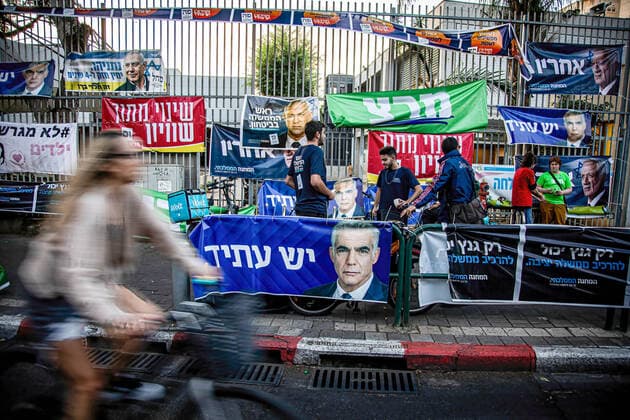 November 1, 2022, Jerusalem, Israel: Election posters of different Israeli political parties outside a polling station in Tel Aviv. With more than 90% of the votes counted former Israeli Prime Minister Benjamin Netanyahu and his block of parties are set to win 65 seats out of the 120 seat Parliament. A come back for Netanyahu, the religious and extreme right nationalist block that he leads. Jerusalem Israel - ZUMAs197 20221101_zaa_s197_546 Copyright: xEyalxWarshavskyx