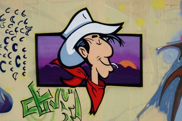 Graffiti in Potsdam Graffiti in Potsdam, 07.08.2022, Potsdam, Brandenburg, An einem Bauzaun befindet sich das Graffiti von Lucky Luke. *** Graffiti in Potsdam Graffiti in Potsdam, 07 08 2022, Potsdam, Brandenburg, On a construction fence is the graffiti of Lucky Luke