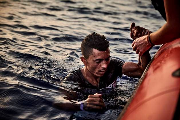 A Tunisian survivor rescued by the members of SOS Mediterranee after he jumped into the sea from the deck of the Ocean Viking. Exhausted by the conditions on board the humanitarian ship and the uncertainty concerning disembarkation, he tried to commit suicide.  AntoninxBuratx xLexPictorium LePictorium_0270071