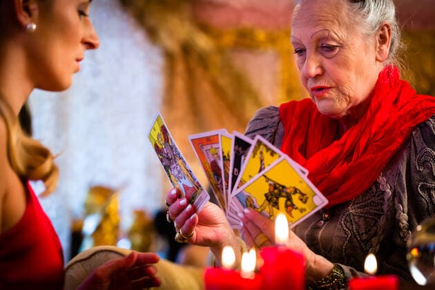 RECORD DATE NOT STATED Fortuneteller laying Tarot cards with client on pentagram, candles are burning, model released, , 36315366.jpg, fortuneteller, client, cards, Tarot, Tarot cards, laying, reading, Future, soothsayer, augur, scyer, foresee, esoteric, spiritual, portend, Seance, interpretation, seeing, clairvoyance, astrology, energy, esoteric, question, spirit, occult, omen, oracle, forecast, session, magic, magical, mystical, eerie, prediction, fair, witchcraft, witch, superstitious, Gypsy, candles, candle, light, book, hands, young, woman, women, old
