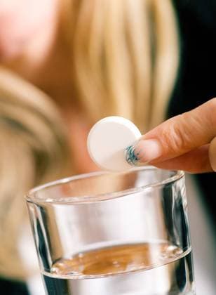 RECORD DATE NOT STATED Woman holding a pill over a glass of water (macro), model released, , 36370214.jpg, migraine, woman, adult, person, Headache, Stress, ill, Illness, sickness, Pain, Cold, Flu, Allergy, Aspirin, Hand, Finger, medicine, water, glass, painkiller, close-Up, hangover, relief, drop, acetylsalicylic acid, pharmaceuticals, drug, pill, health, macro