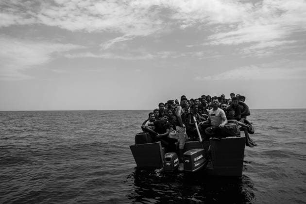 A hundred exiled people are crammed onto a boat. MSF teams respond to the rescue of a boat in distress north of the Libyan coast. MSF has been involved in various search and rescue operations at sea since 2015. With its latest boat, the Geo Barents, the NGO is helping people fleeing Libya and trying to cross the Mediterranean to reach the European continent. Between 2017 and 2021, at least 8,500 people died or went missing. 27 June 2022. Central Mediterranean.  MichaelxBunelx xLexPictorium LePictorium_0270361
