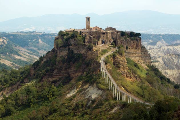 RECORD DATE NOT STATED Civita di Bagnoregio is a town in the Province of Viterbo in Central Italy, a frazione of the comune of Bagnoregio , 6502158.jpg, bagnoregio, civita, italy, ancient, bridge, building, country, fortress, hill, hilltown, landscape, lazio, nature, old, rock, ruins, rural, stone, town, travel, citadel, cliff, course, defend, etrurian, europe, high, peak, road, rope, scape, visitors, viterbo, architecture, church, city, historic, summer, tuff, borgo, etruscan, pedestrian, plateau, umbria, abandoned, ages, erosion, footbridge, history, uninhabited,