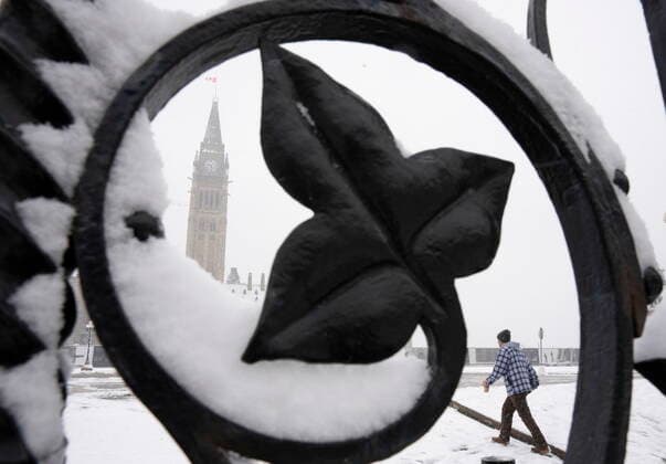 November 16, 2022, Ottawa, ON, Canada: A man walks on to Parliament Hill in downtown Ottawa, Wednesday, November 16, 2022 as the city faces its first snowfall of the season. Ottawa Canada  - ZUMAc35_ 20221116_zaf_c35_060 Copyright: xAdrianxWyldx