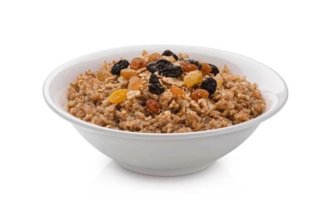 Bowl of buckwheat flakes isolated on white background Bowl of buckwheat flakes isolated on white background, healthy buckwheat breakfast Copyright: xZoonar.com MaksimxLashcheuskix 18825410