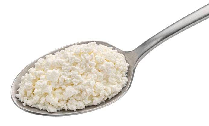 Cottage cheese in spoon isolated on white background Cottage cheese in spoon isolated on white background, top view Copyright: xZoonar.com MaksimxLashcheuskix 19118511