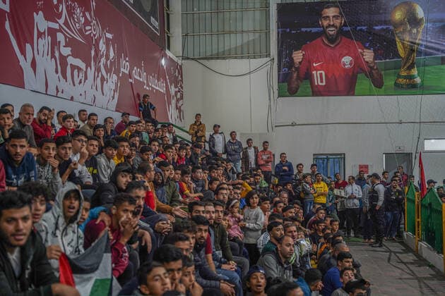 November 20, 2022, Gaza, Palestine: Thousands of Palestinians participated in attending the opening ceremony of the World Cup and attending the opening match between Qatar and Ecuador. The Qatari committee established a headquarters to display the matches throughout the World Cup for free in Saad Sayel Hall in the center of the Gaza Strip. The Palestinians in Gaza encouraged the national team And they sent motivational messages to the Qatari team via screens.  Copyright: xSaherxElghorrax
