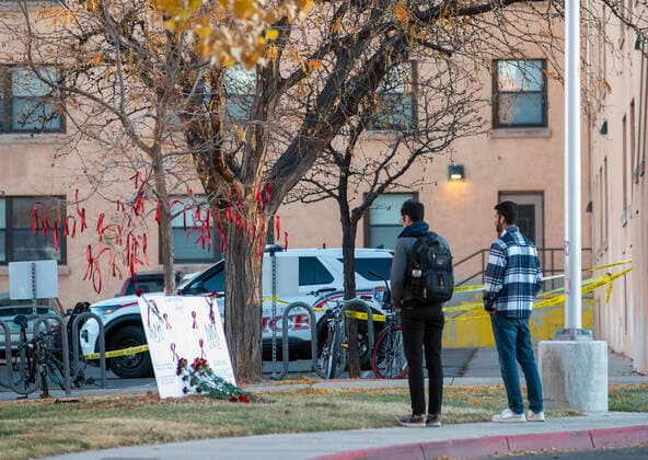 November 20, 2022, Albuquerque, New Mexico, USA: Journal .Students stop to pay their respects at a memorial for the 19 year-old UNM student fatally shot on campus early Saturday morning. The shooting left a New Mexico State University MenÃ¢â‚¬â ¢s Basketball player wounded . Photographed on Sunday November 20, 2022 JOURNAL Albuquerque USA - ZUMAab1_ 20221120_zaf_ab1_002 Copyright: xAdolphexPierre-Louisx