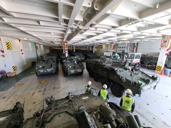 Soldiers and civilians offload Stryker vehicles belonging to 2nd Stryker Brigade Combat Team, 2nd Infantry Division, Joint Base Lewis-McChord, Wash. at the Port of Pyeongtaek, South Korea Oct. 8, 2022. The vehicles were off loaded by members of the 837th Transportation Battalion, the 19th Expeditionary Sustainment Command, and the 2nd Infantry Division. The 2-2 SBCT will serve a nine-month tour of duty in Korea, the first for the unit and the 12th iteration overall since the start of the Korea Rotational Force began.