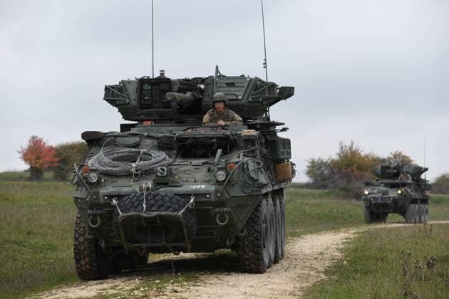 U.S. Soldiers, assigned to Palehorse Troop, 4th Squadron, 2nd Cavalry Regiment, maneuver in their Stryker vehicles during a situational training exercise at the 7th Army Training Command s Grafenwoehr Training Area, Germany, Oct. 13, 2022. 2CR provides the 7th ATC with a lethal and agile force capable of rapid deployment throughout the European theater in order to assure allies, deter adversaries, and when ordered, defend the NATO alliance.
