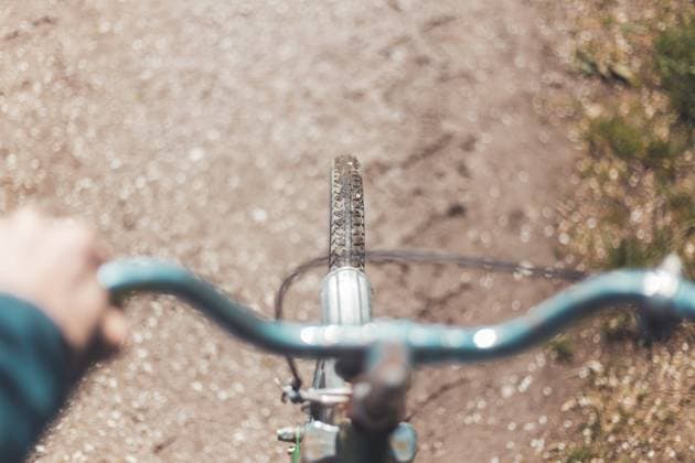 Retro bike tour: Tire of bike outdoors, rural scene, blurry handlebar Close up picture of retro bike tire, blurry handlebar, summer day Copyright: xZoonar.com PatrickxDaxenbichlerx 16723687 ,model released, Symbolfoto ,property released